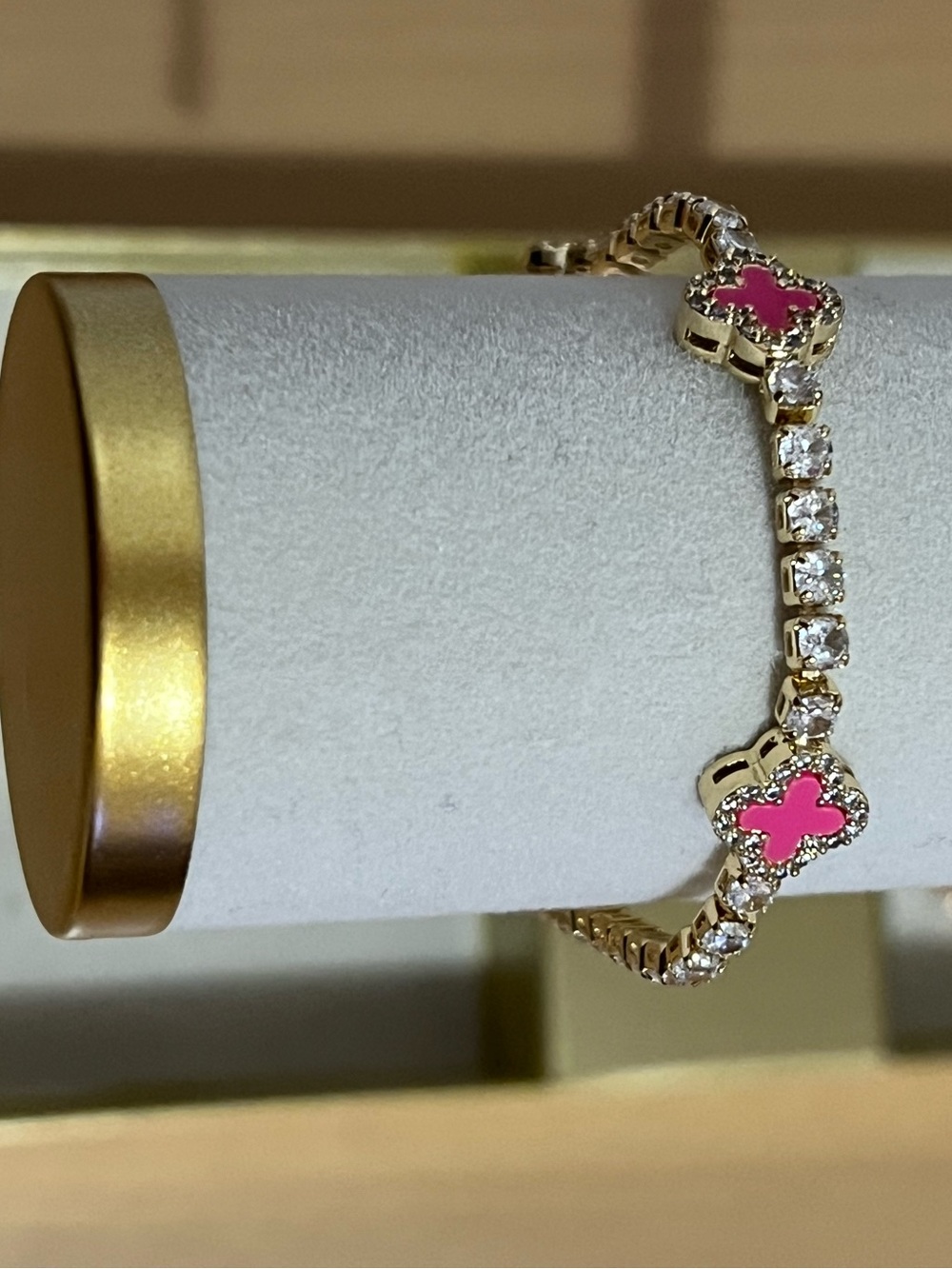 Gold Tone Bracelet with Pink Clover Accents and Clear Crystals